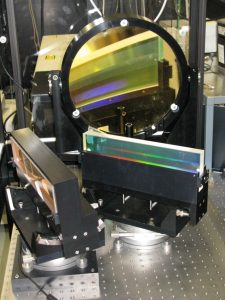 Two gratings and spherical mirror comprising the Gemini pulse stretcher.